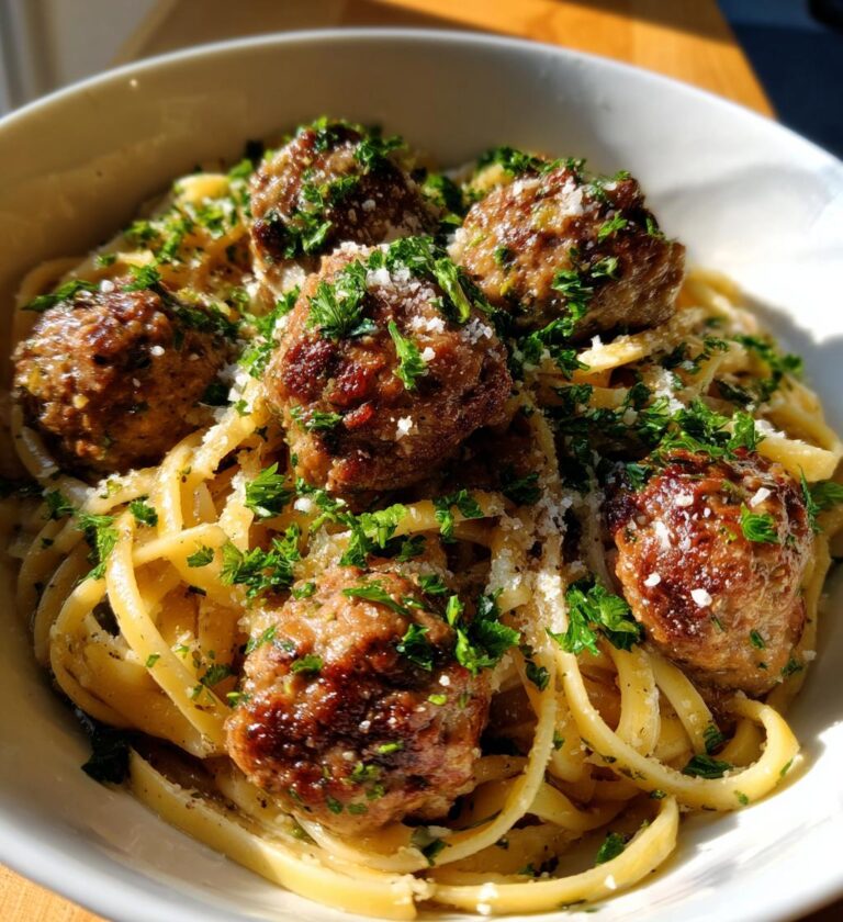 garlic butter meatballs served over creamy parmesan linguine